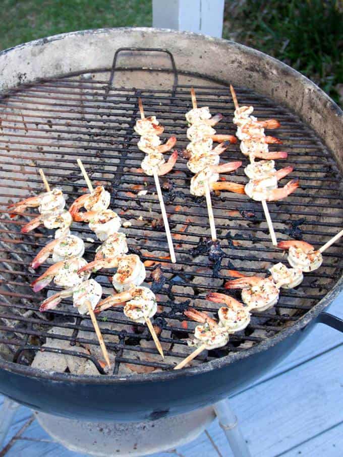 Cooking the shrimp over coals