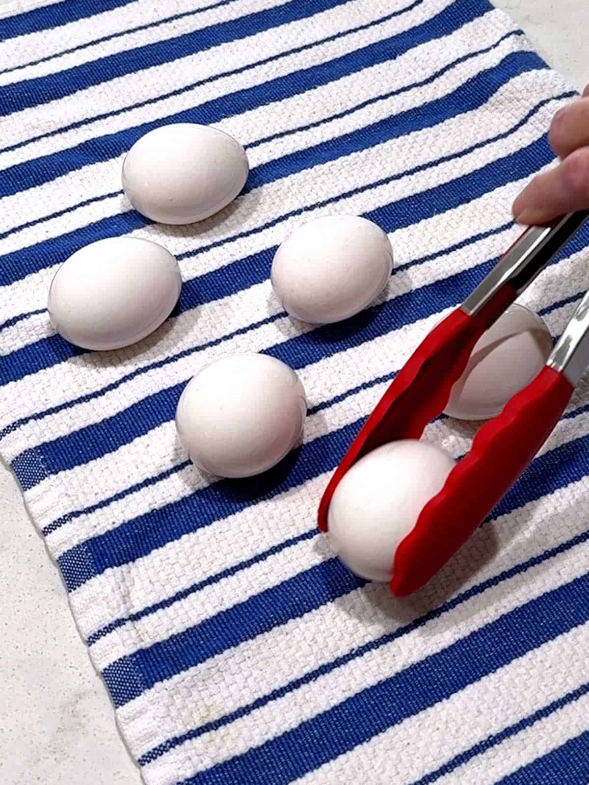 Drying eggs on a dish towel.