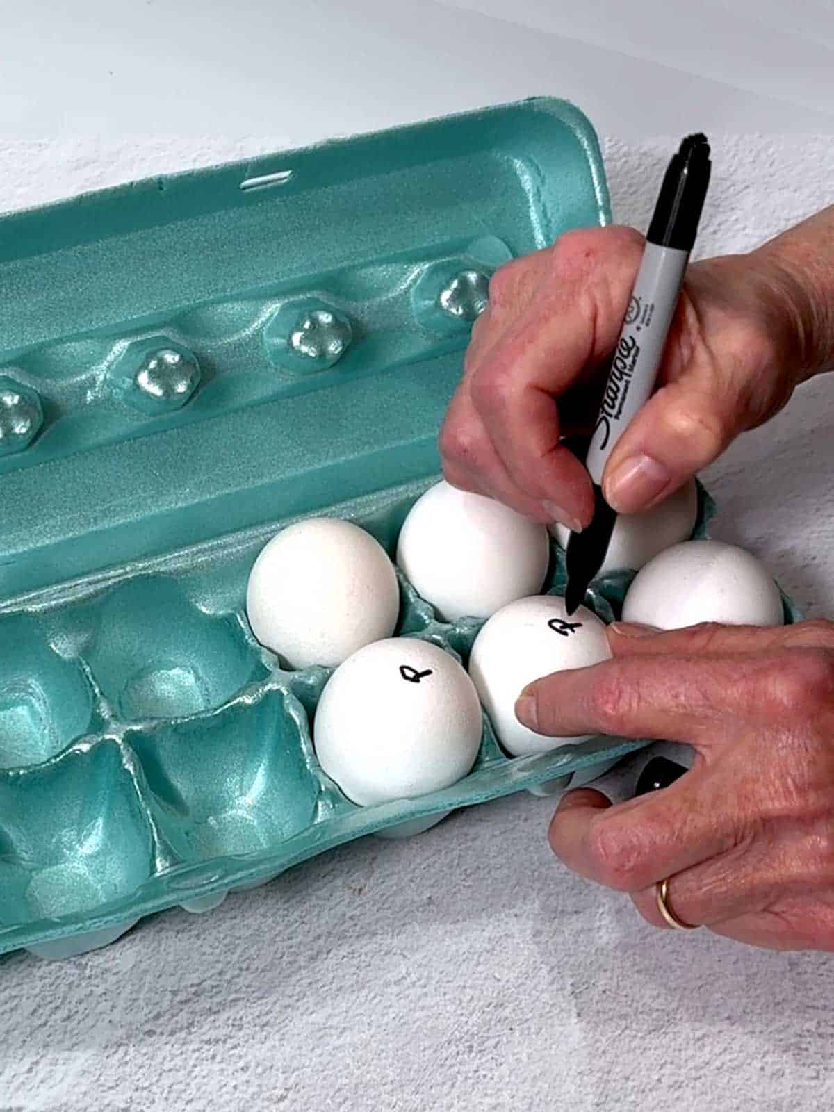 Marking the eggs with a P for Pasteurized.