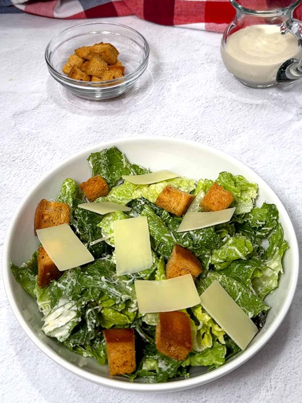 Caesar salad with homemade croutons and shaved Parmesan cheese.