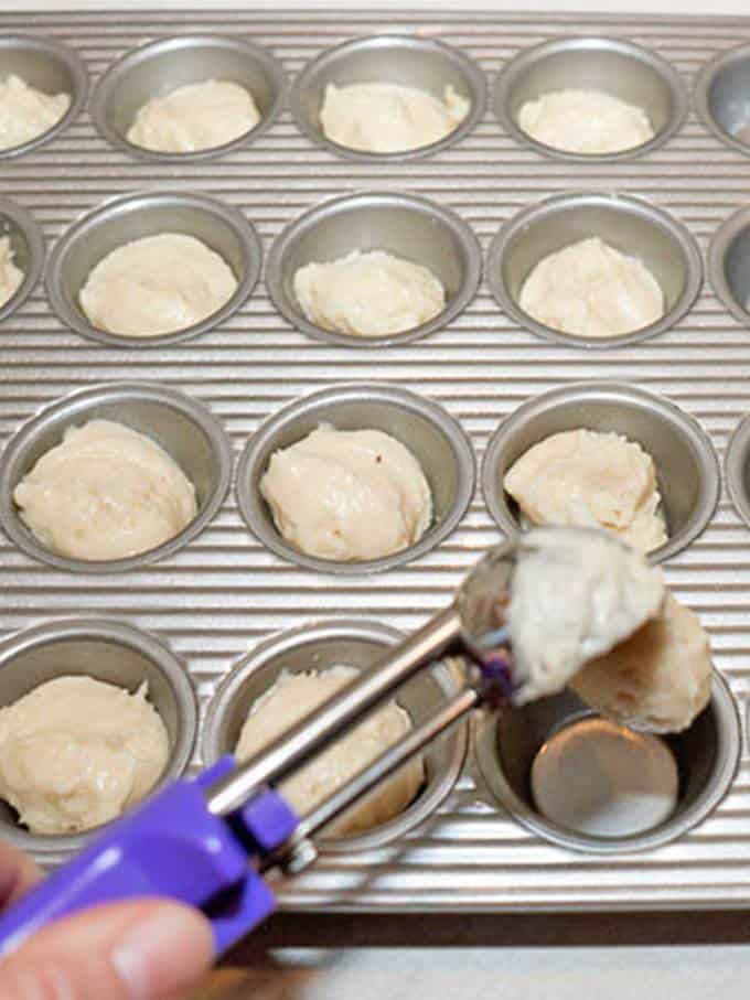Scooping batter into mini muffin pan