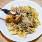 Noodles topped with a blend of tender chicken and cremini mushrooms in a delicious creamy sauce.