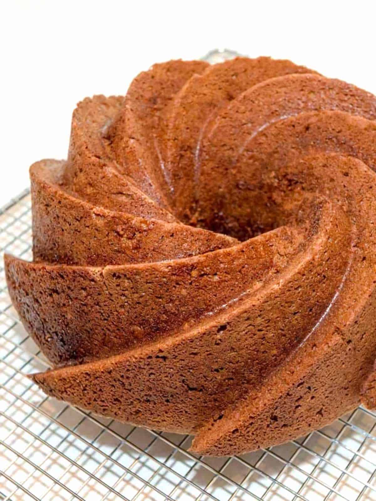 Bundt cake cooling on wire rack.