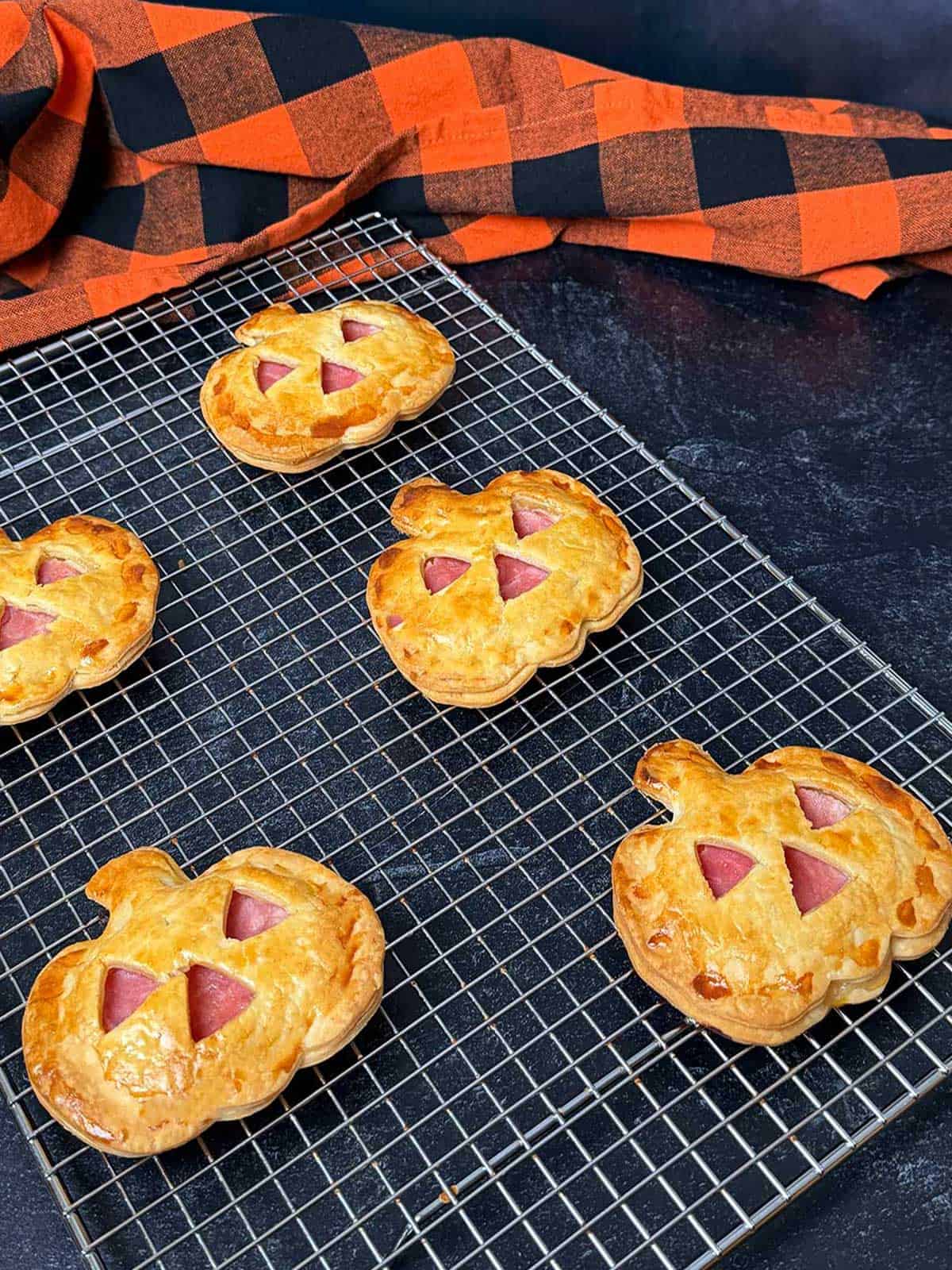 Cooling the ham and Swiss hand pies on a wire rack.