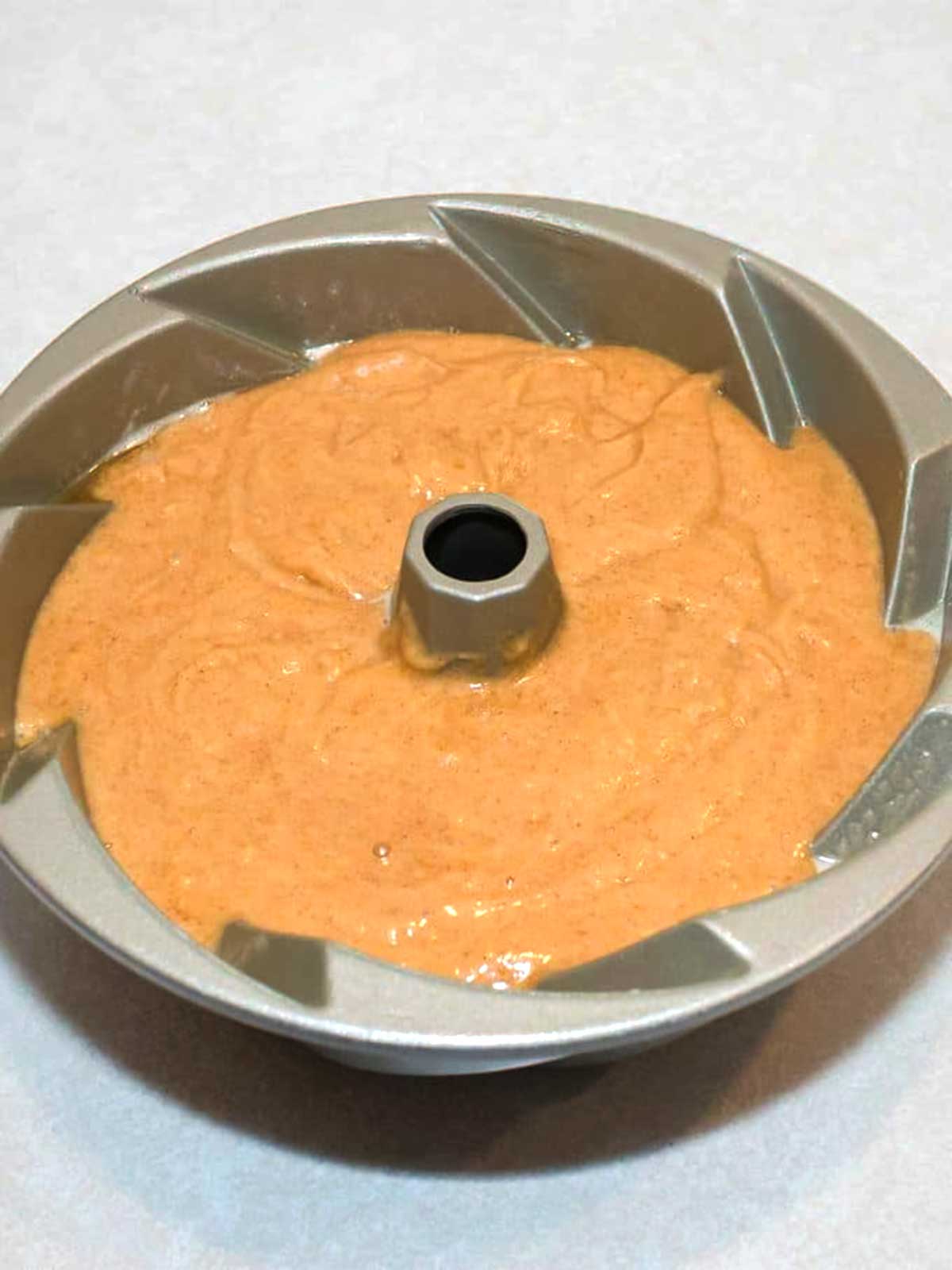 Pumpkin batter in the bundt pan.