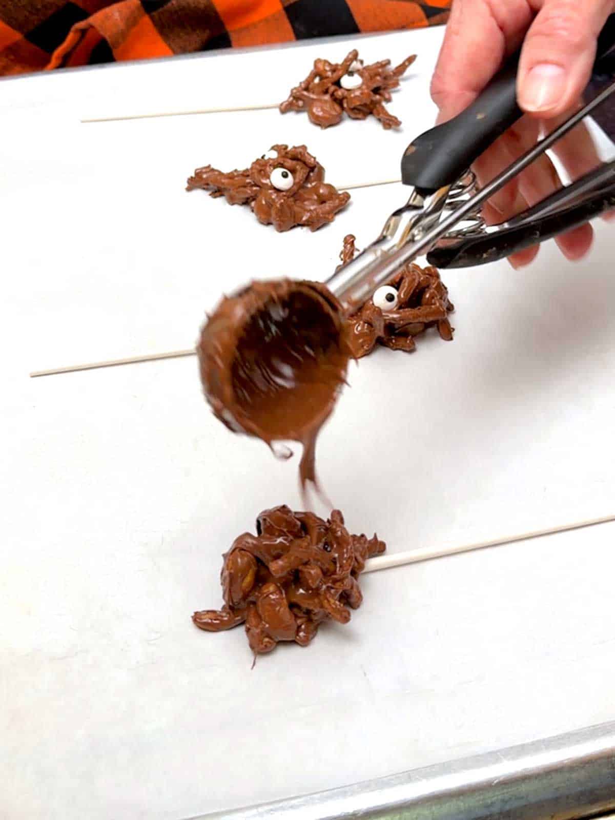 Dropping the haystack mixture onto a lolipop stick.