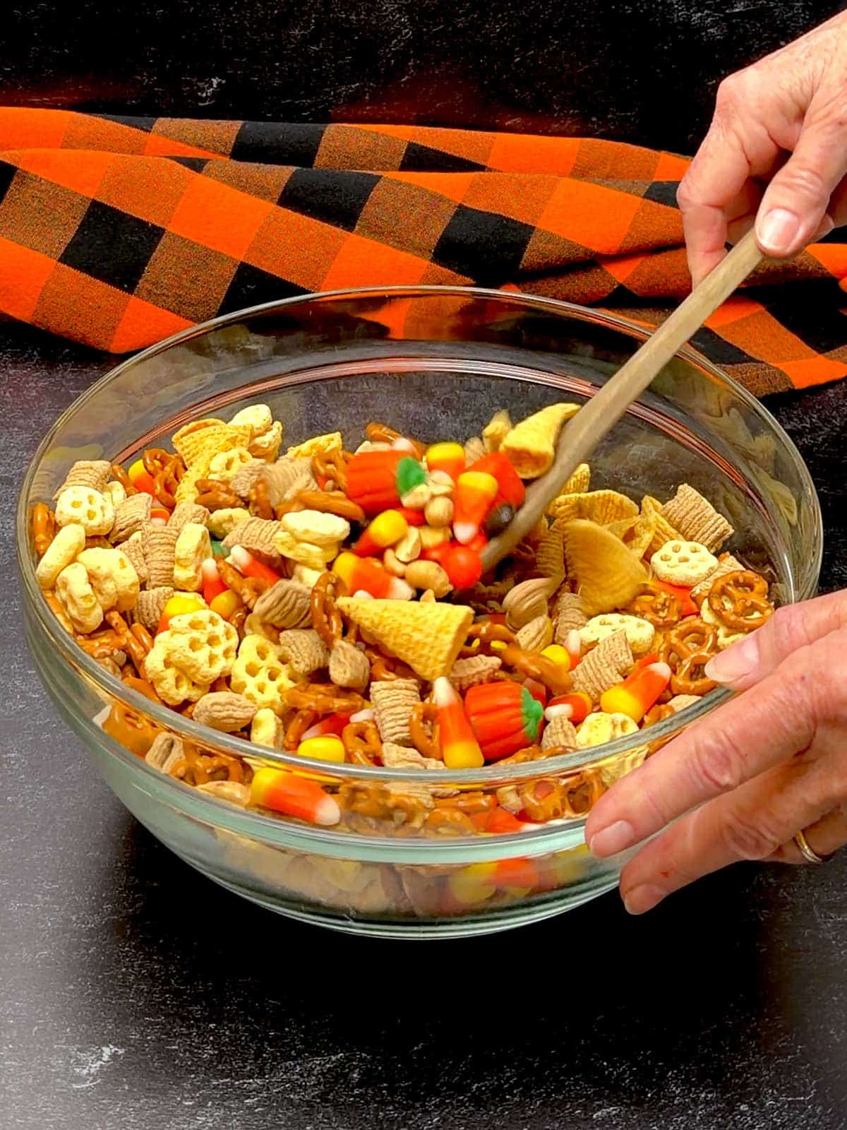 Stirring the ingredients for the Monster Munch with a wooden spoon.