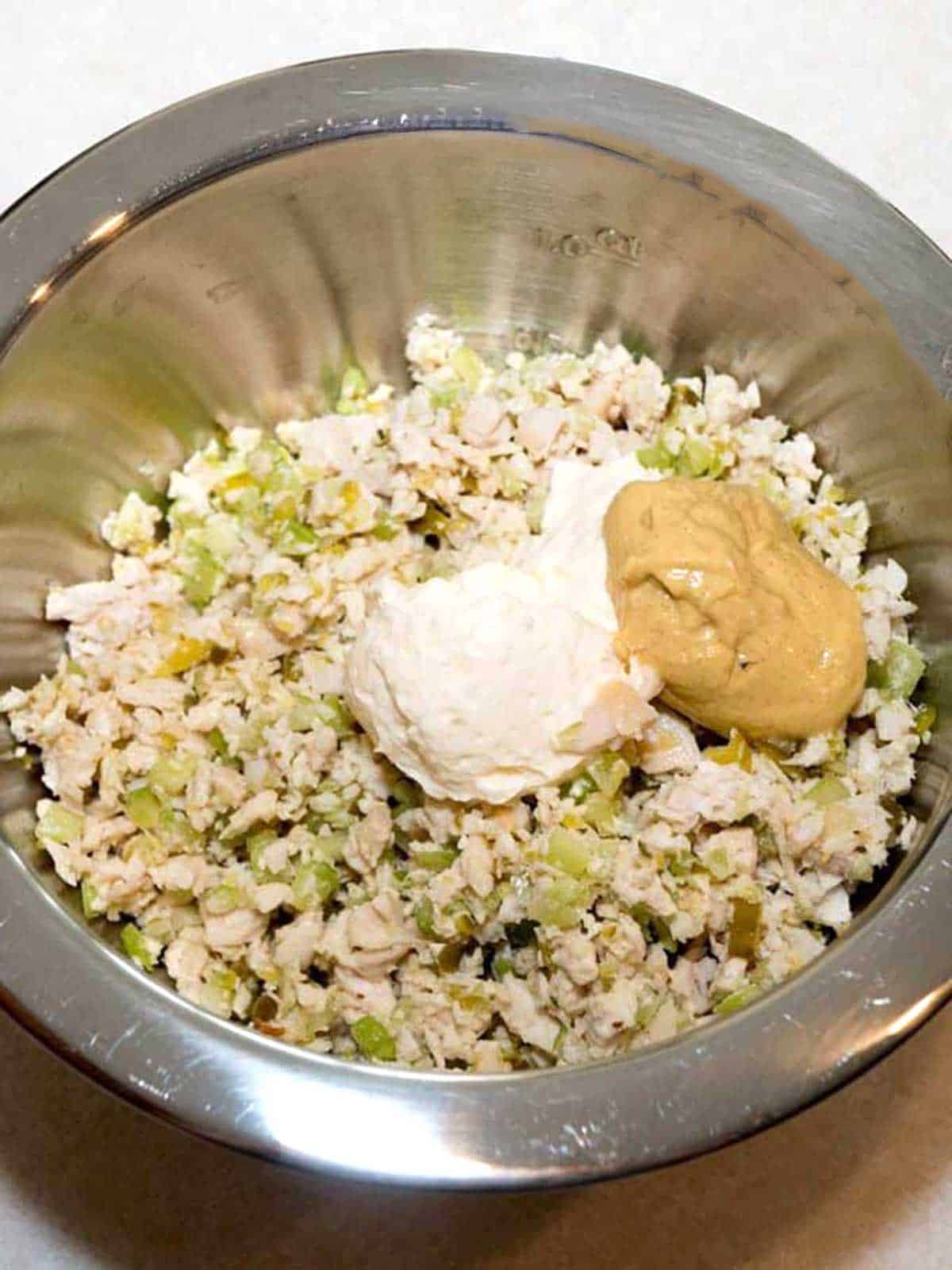 Mayo and mustard added to turkey salad.