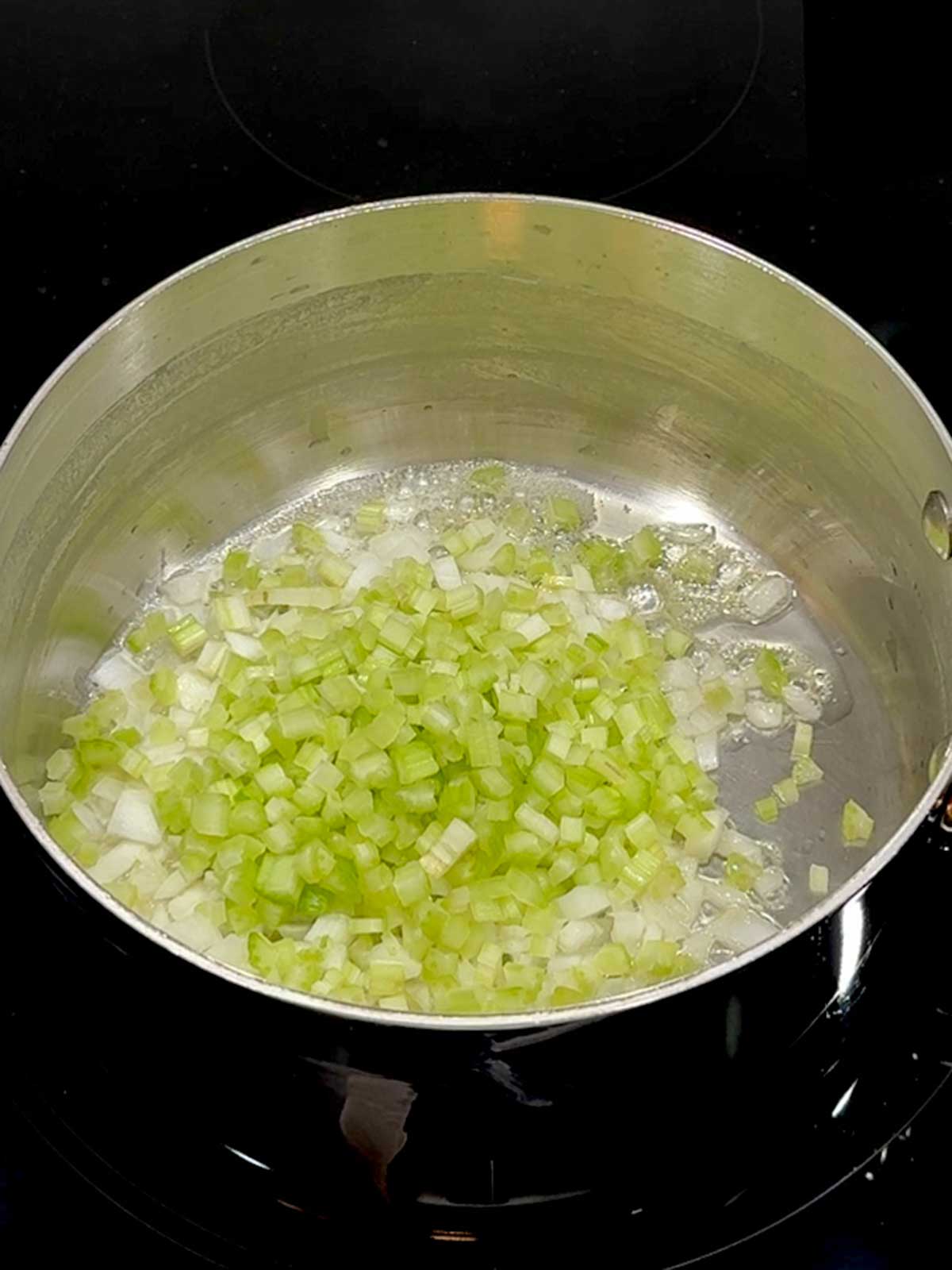 Onions and celery in butter in the saucepan.