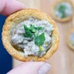Make Ahead Mushroom Croustades are an elegant bite-sized holiday appetizer. With rich and creamy mushroom filling in a crispy toasted bread shell, they will WOW your most discerning guest