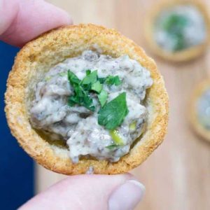 Make Ahead Mushroom Croustades are an elegant bite-sized holiday appetizer. With rich and creamy mushroom filling in a crispy toasted bread shell, they will WOW your most discerning guest