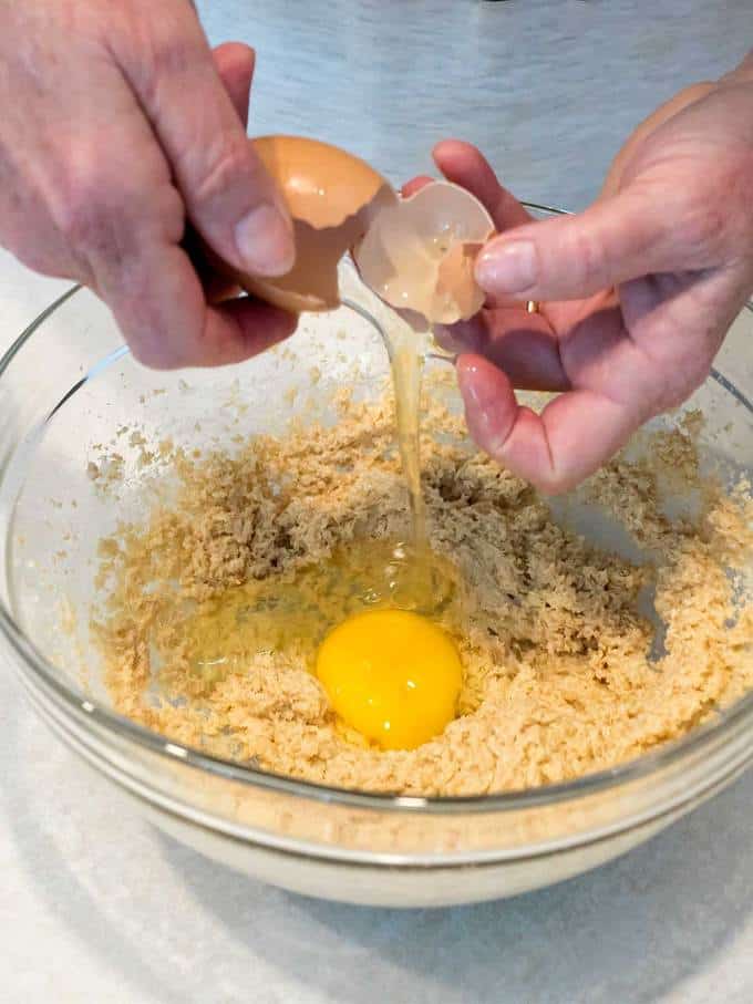 Adding egg to cookie dough
