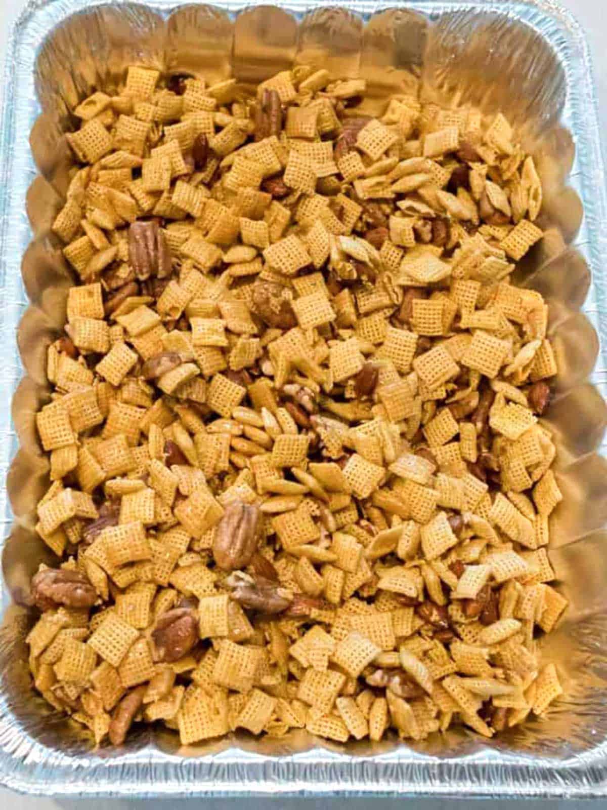 Mixture in large disposable roasting pan ready for oven.