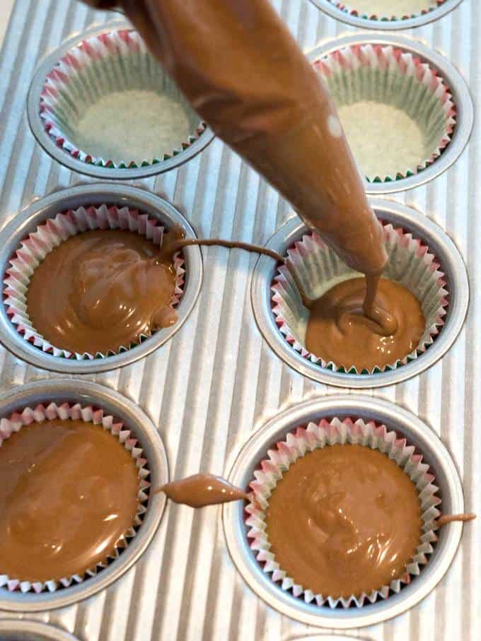 Piping the mixture into cups