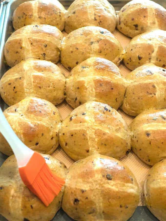 Brushing Hot Cross Buns with Egg Wash