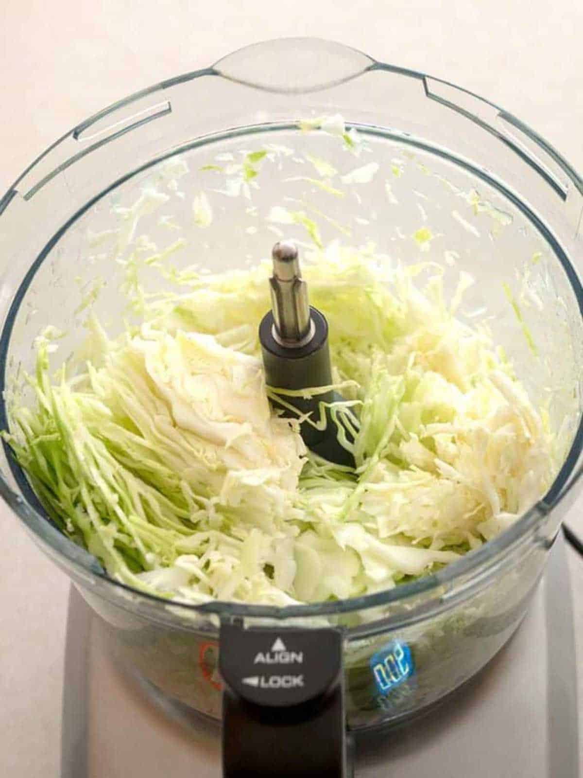 Cabbage sliced in food processor.