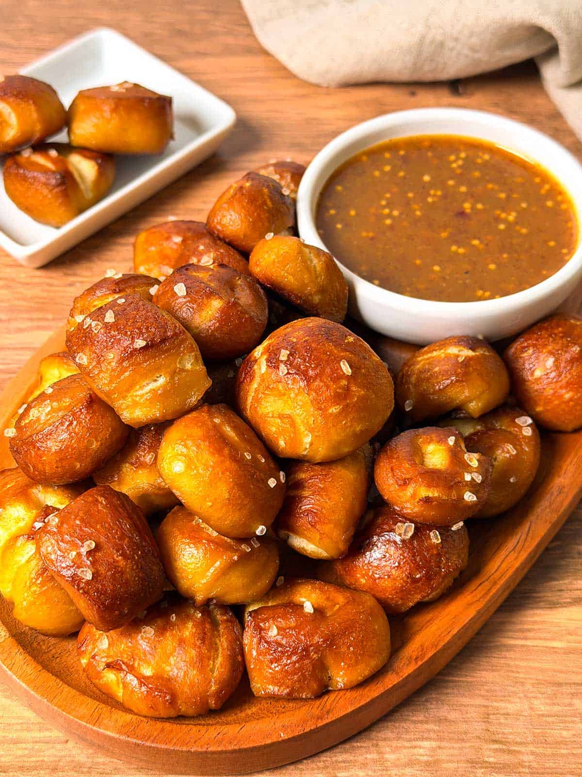 Pretzel bites with honey, mustard, raspberry dipping sauce.