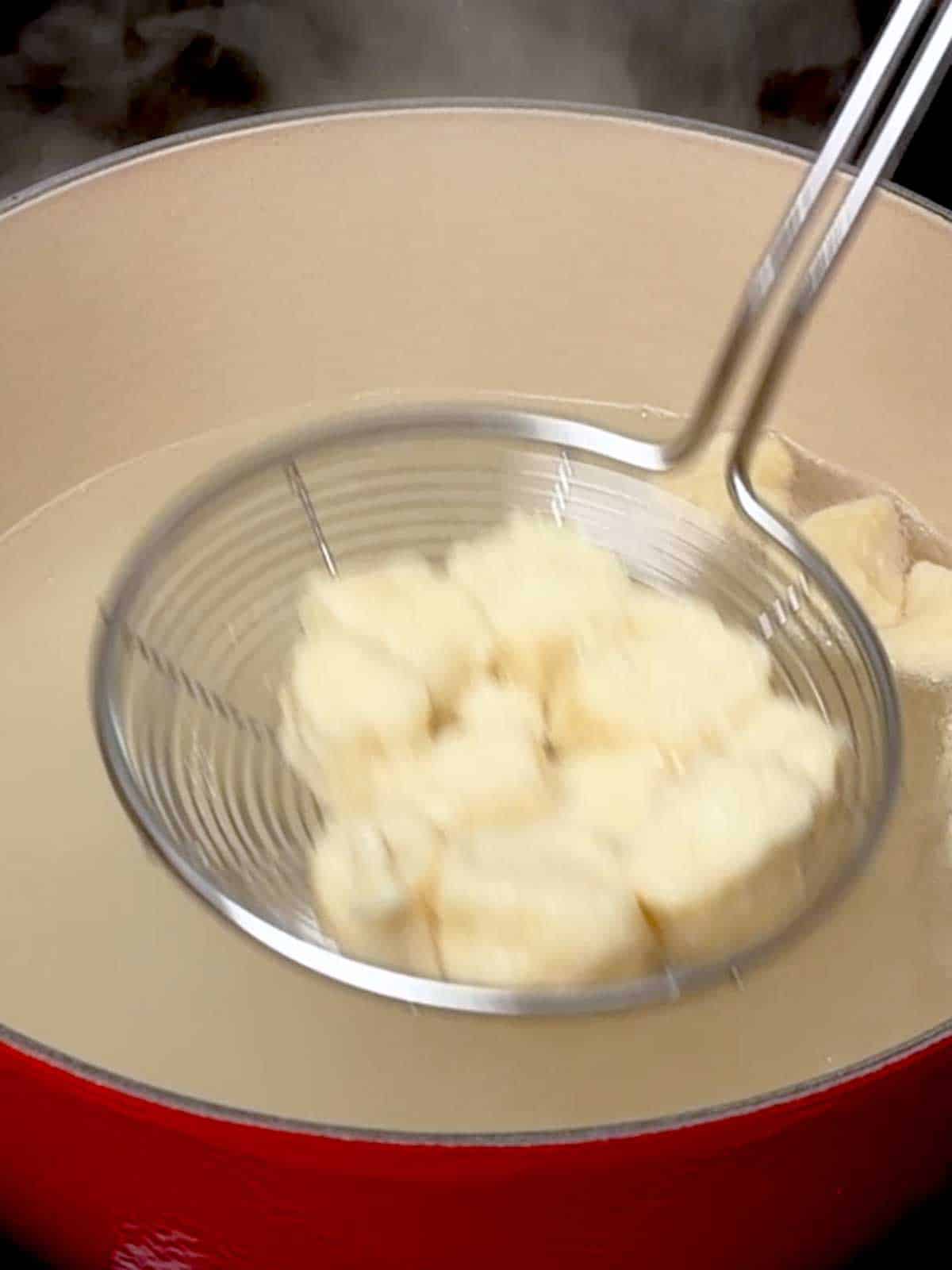 Removing pretzel bites from water.