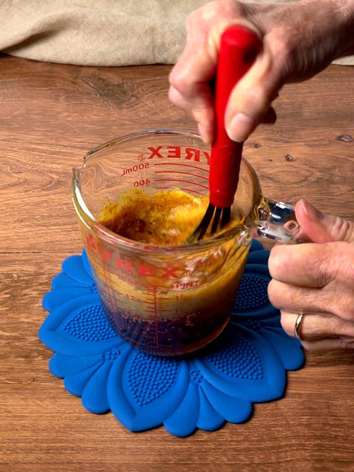 Whisking the honey, mustard, raspberry dip.