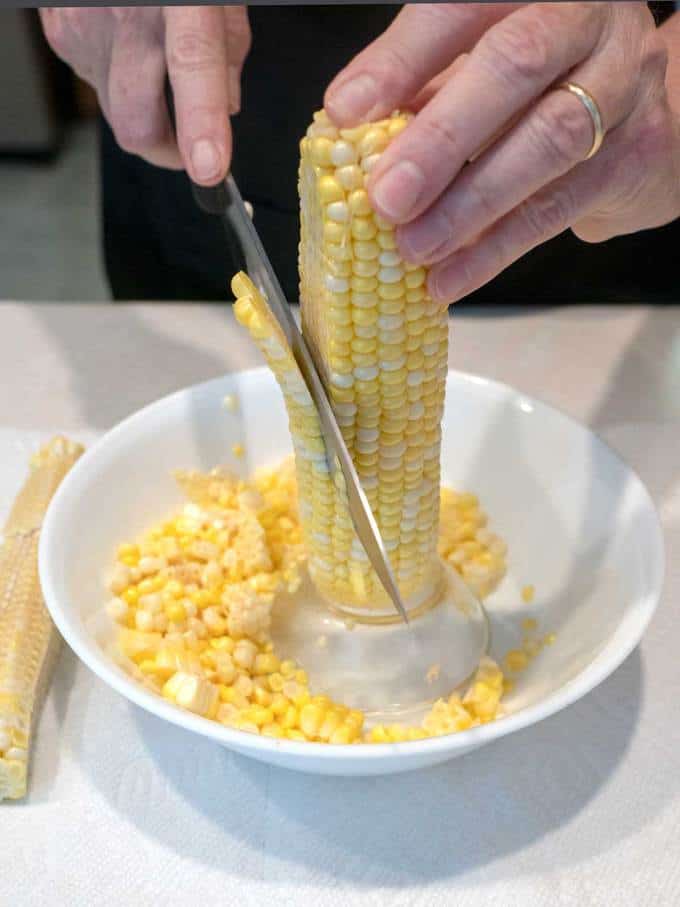 Cutting the Corn for the Fresh Sweet Corn Fritters with Honey Chipotle Sauce