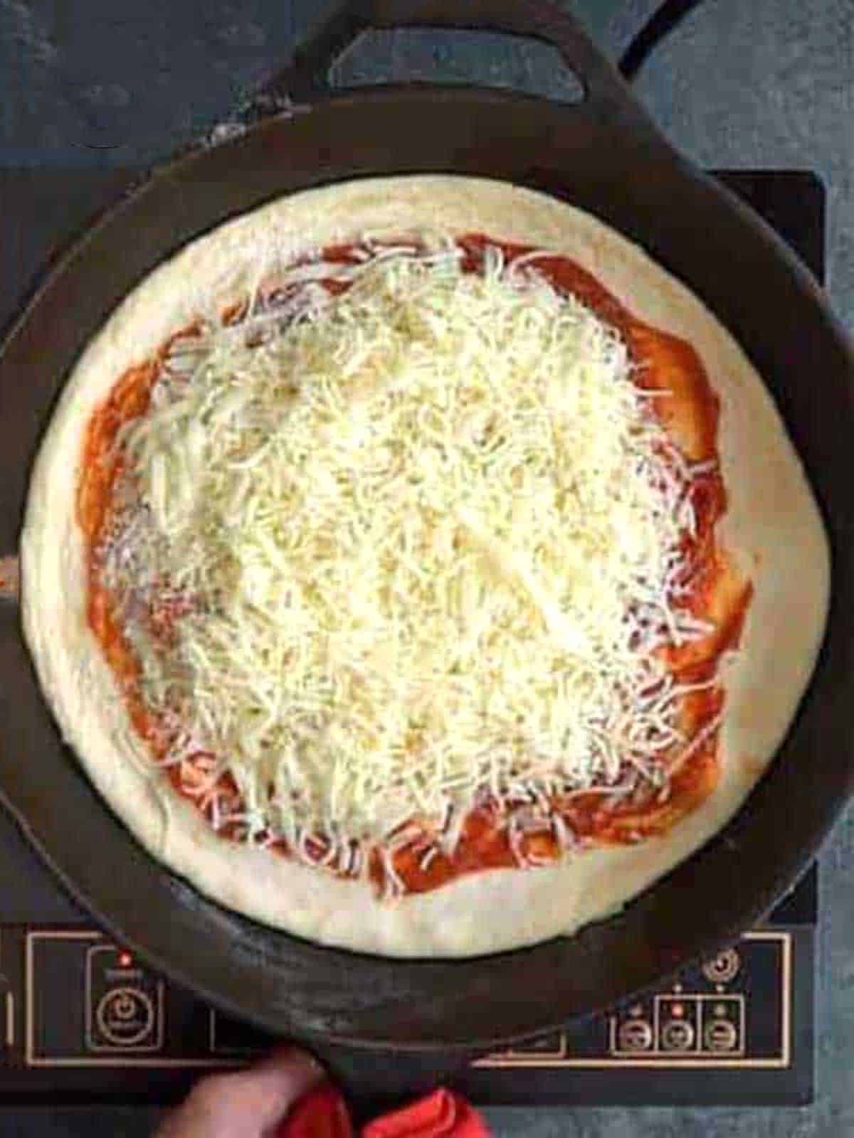 Transferring the pizza to the oven.