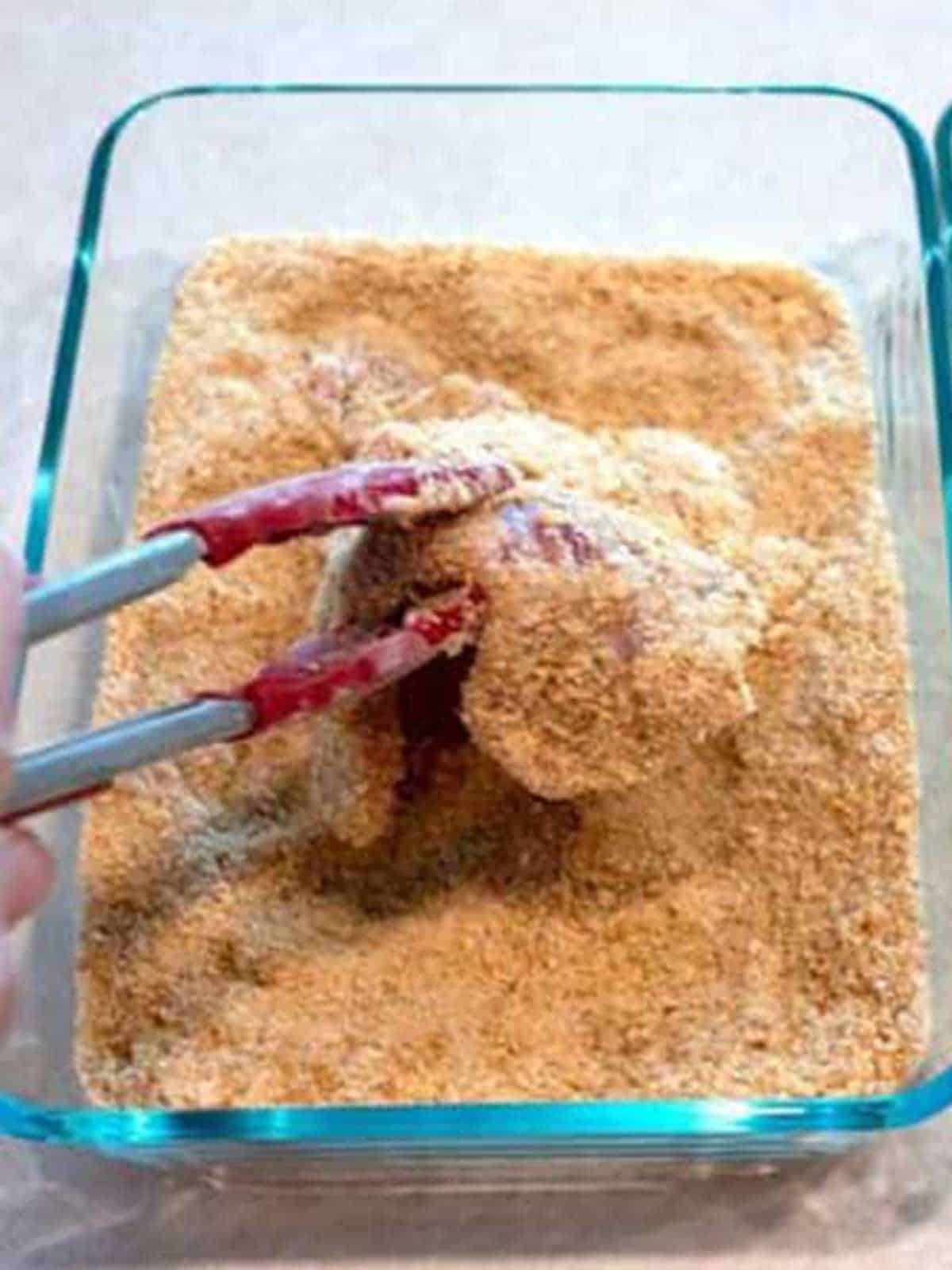 Breading the pork.