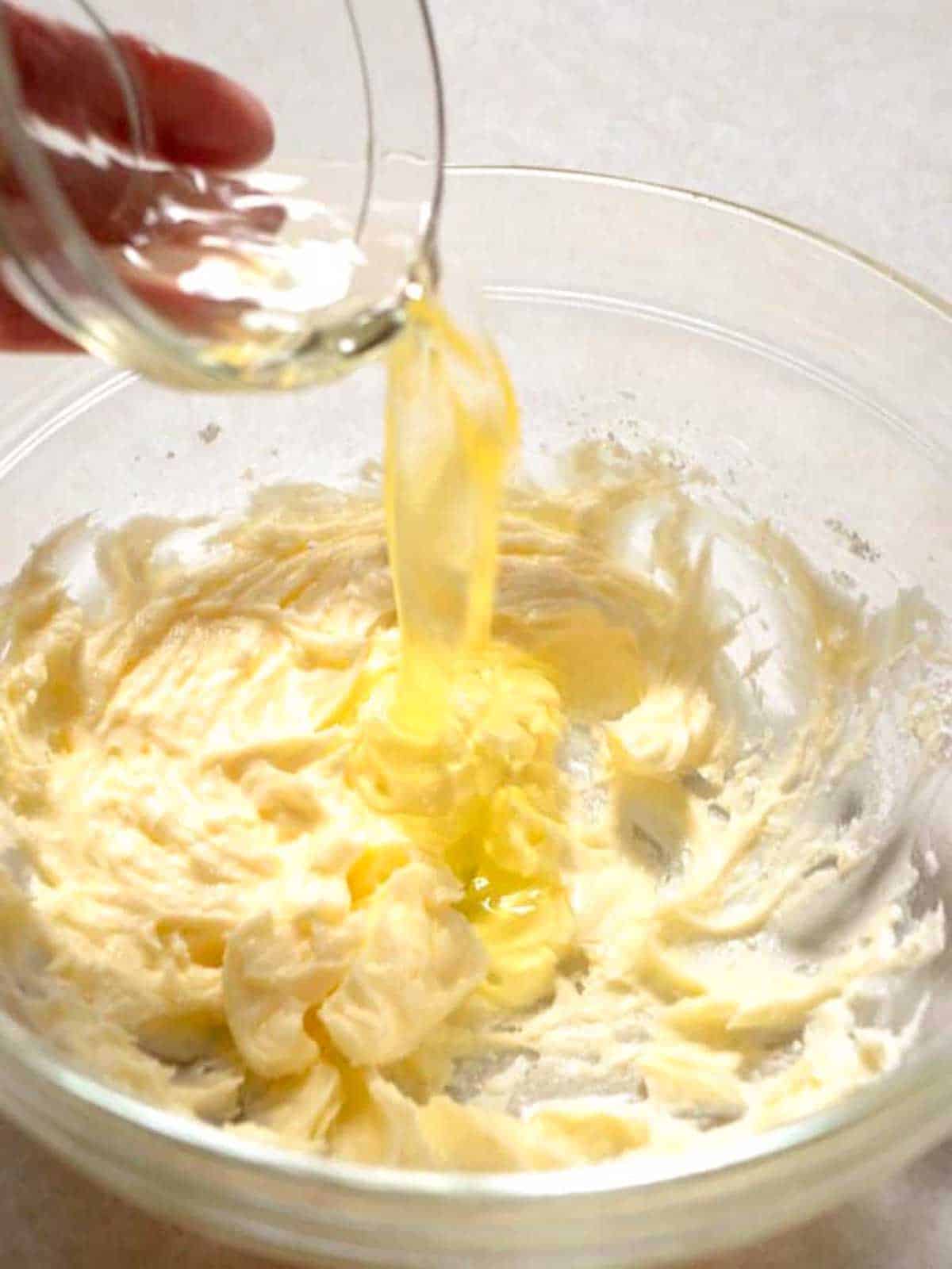 Adding egg white to the bowl.