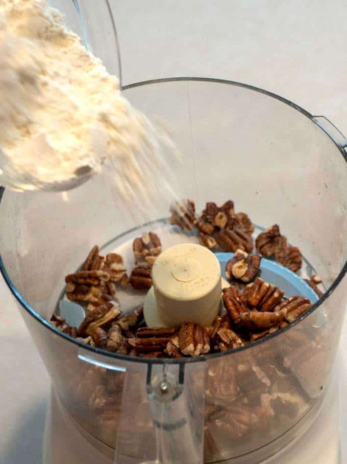 Adding Flour to Food Processor with Pecans