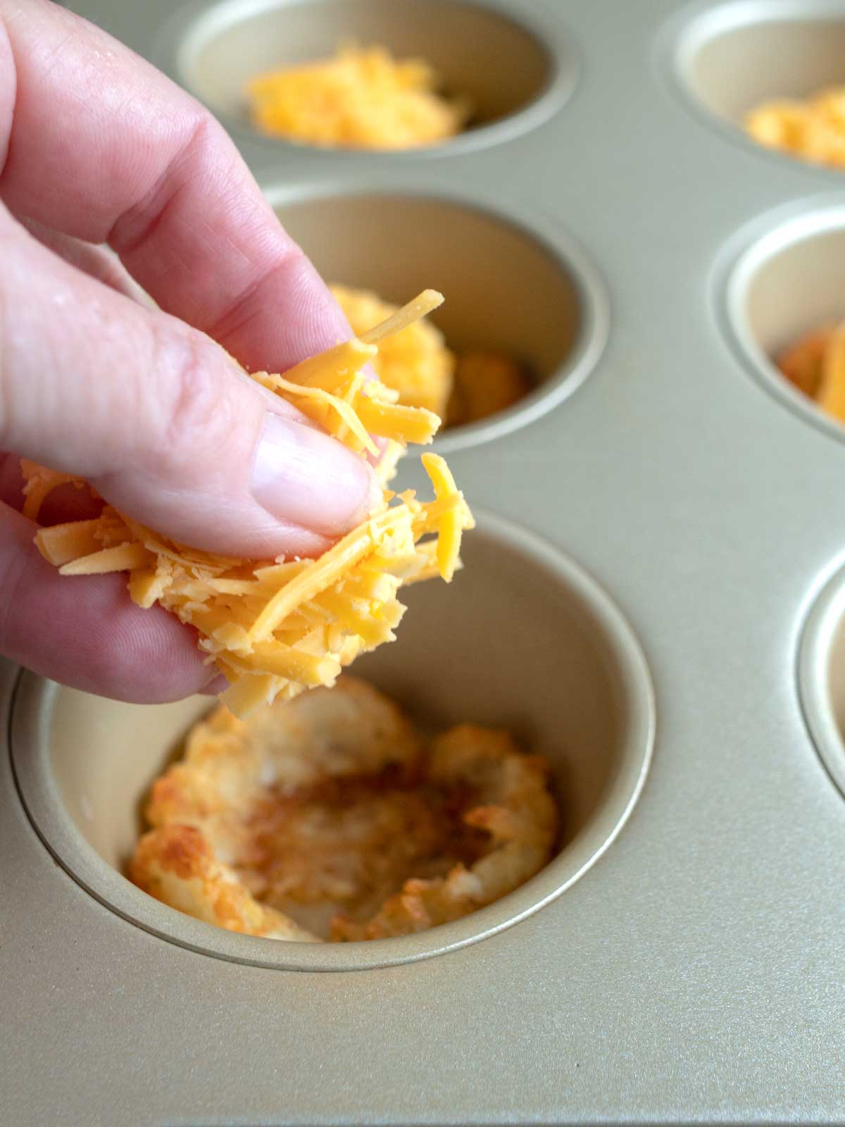 Adding Cheese to Potato Cups