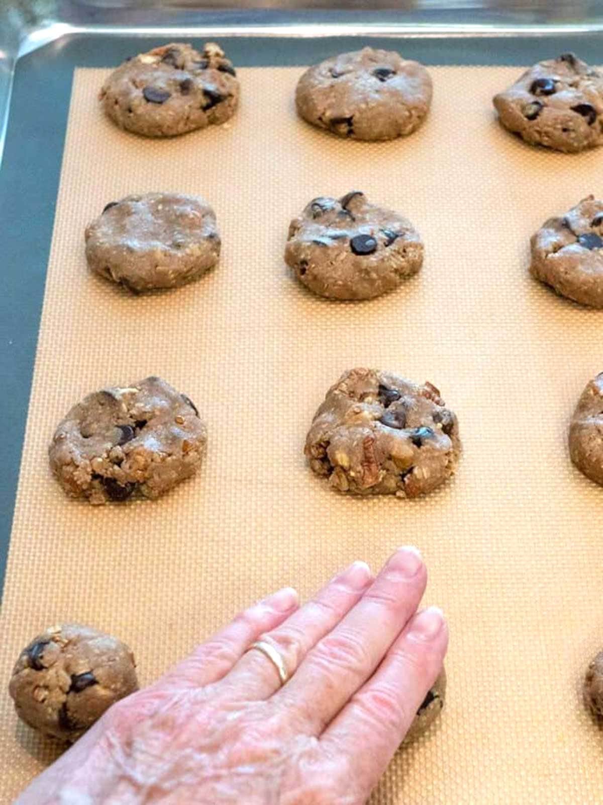 Flattening the dough.