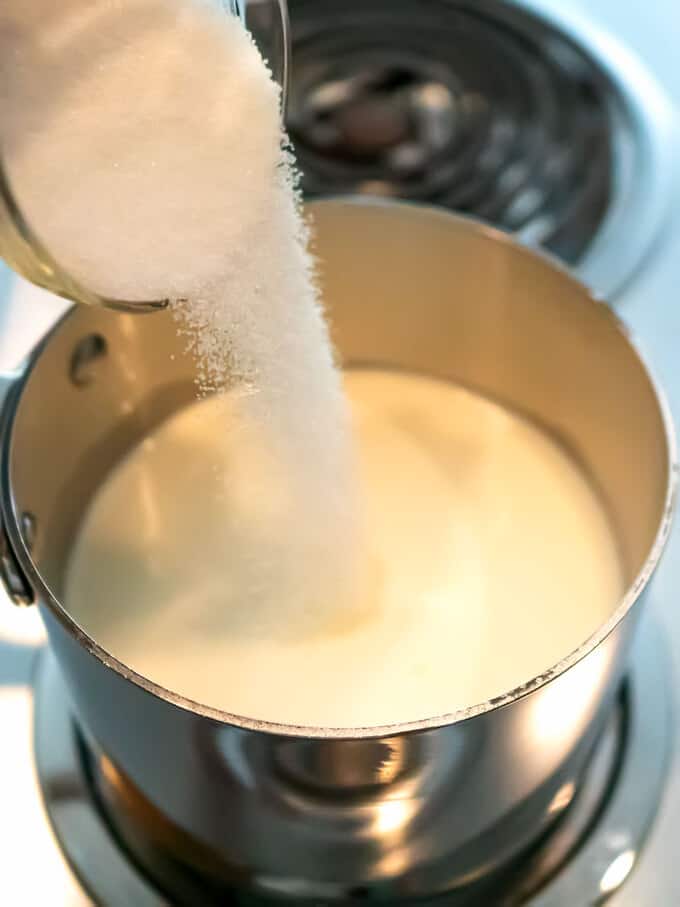 Adding Sugar to Milk and Cream in Saucepan