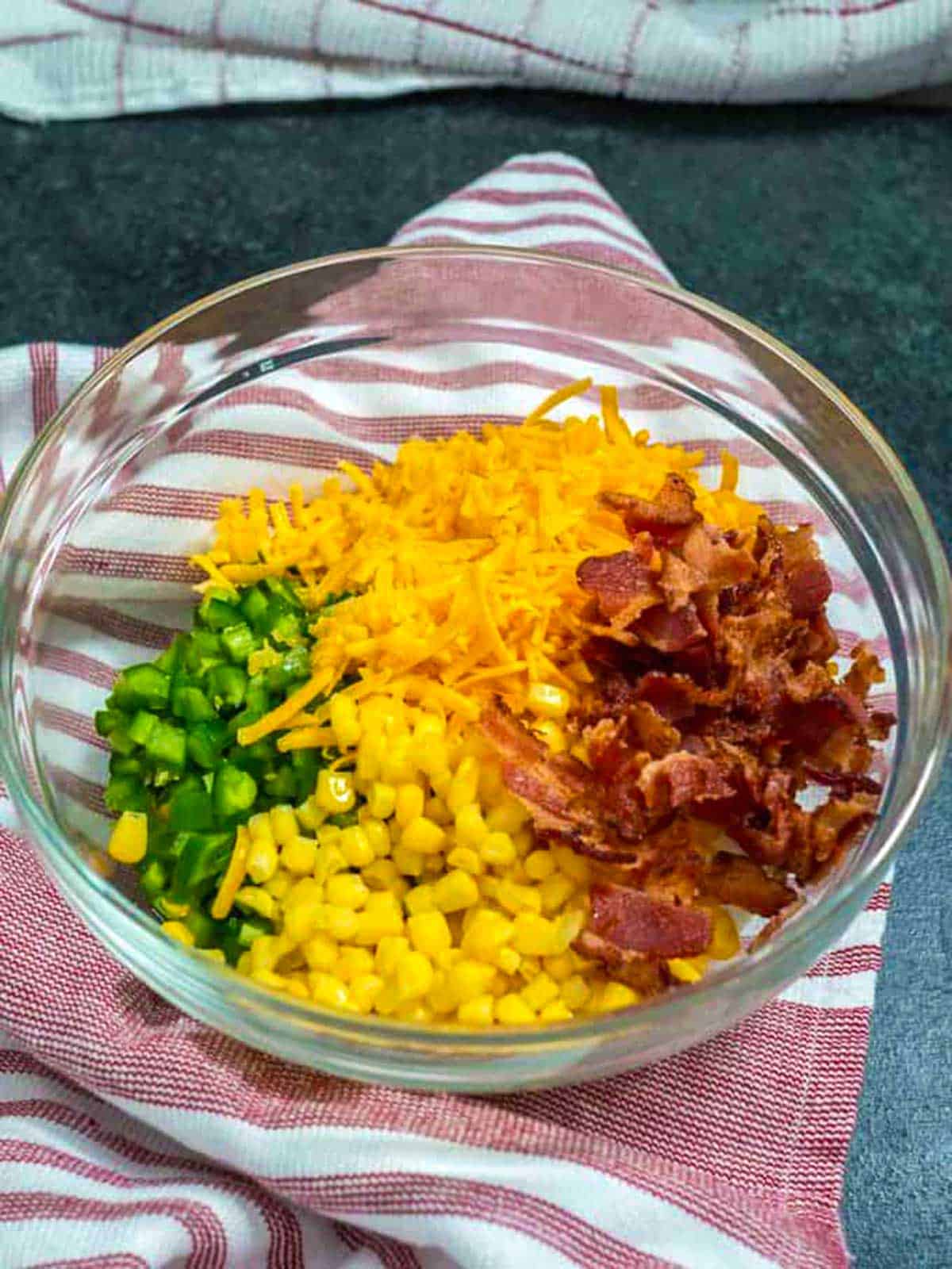 Ingredients for jalapeno popper dip in a bowl.