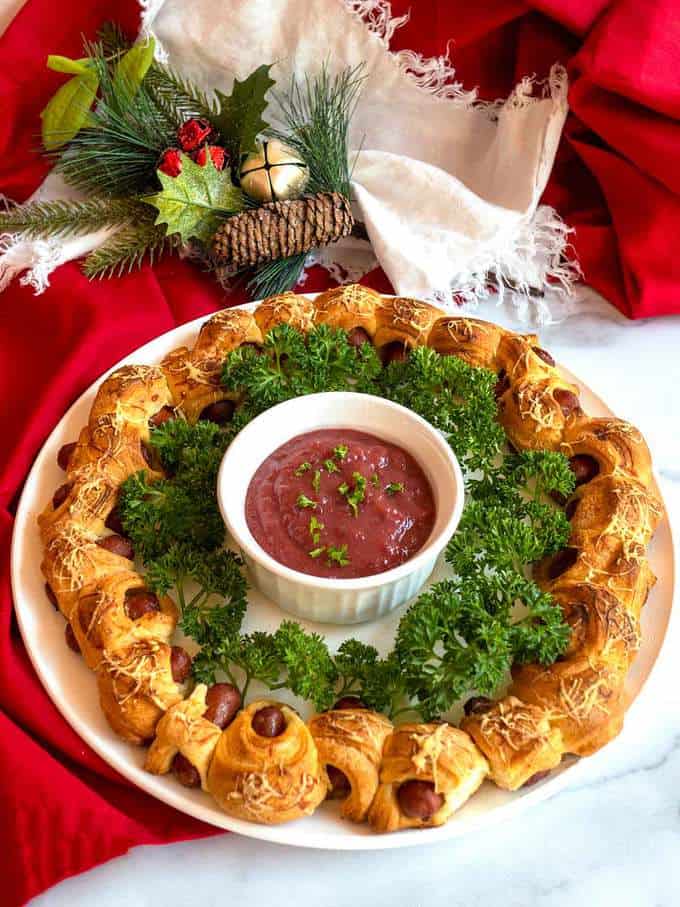 Pigs in a blanket wreath with cranberry honey mustard dipping sauce