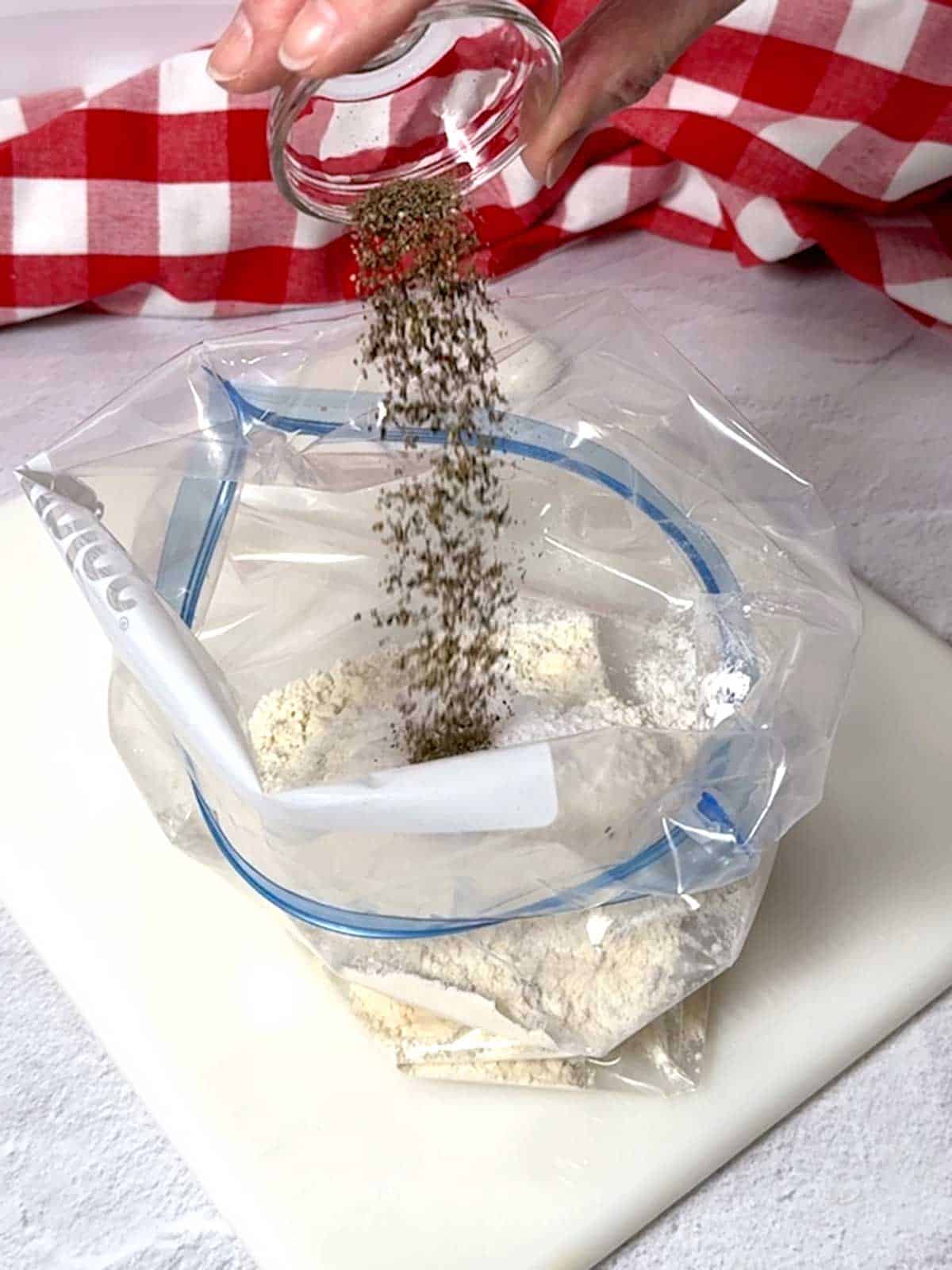 Adding pepper to the Ziploc bag.