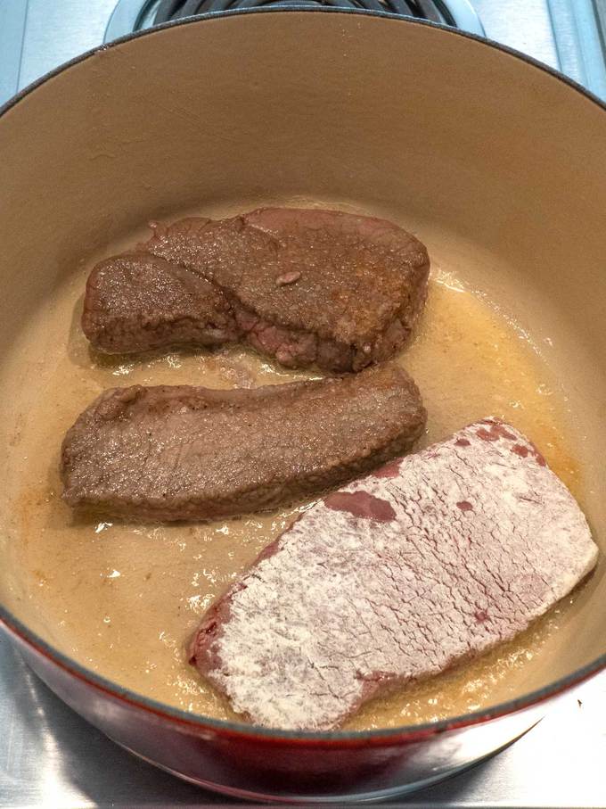 Browning the beef in a Dutch oven