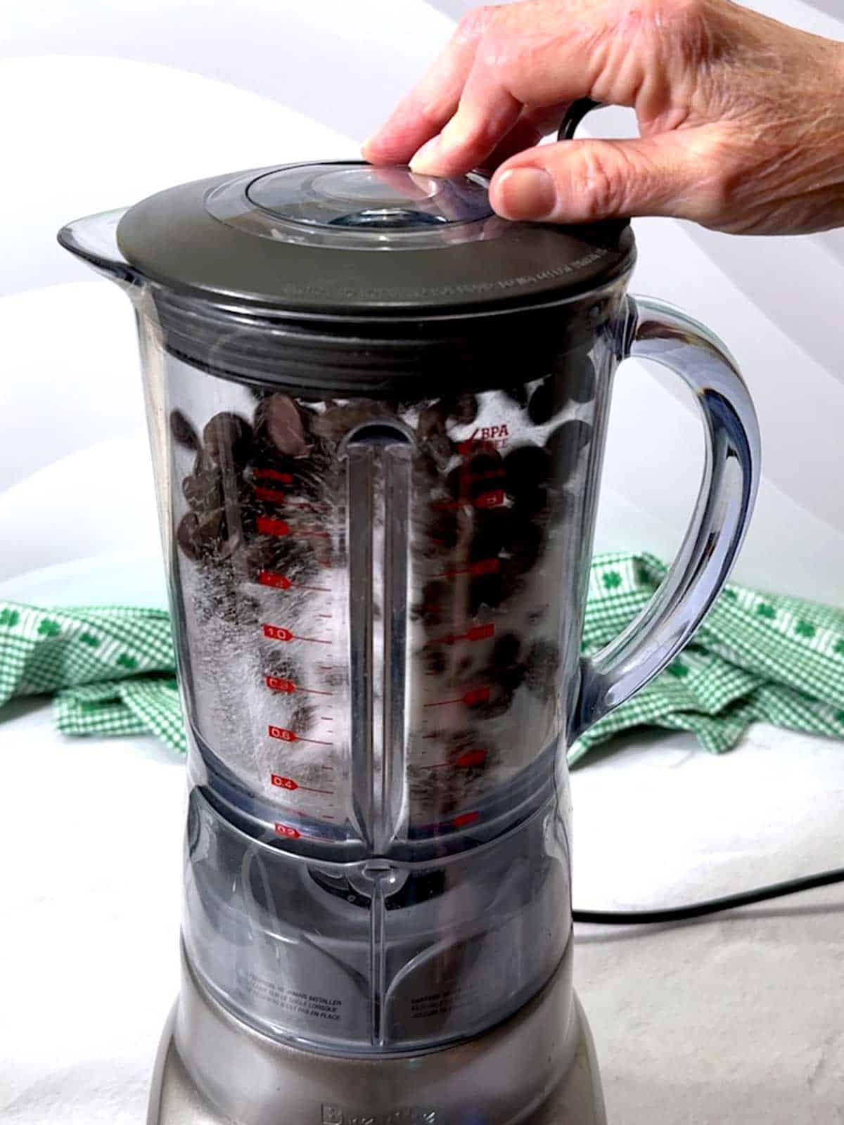 Processing chocolate chips, sugar, and salt in the blender.