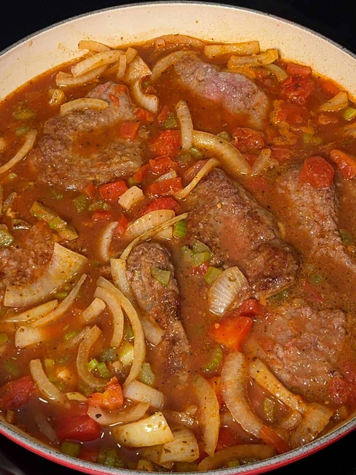 Beef added to the Dutch oven.