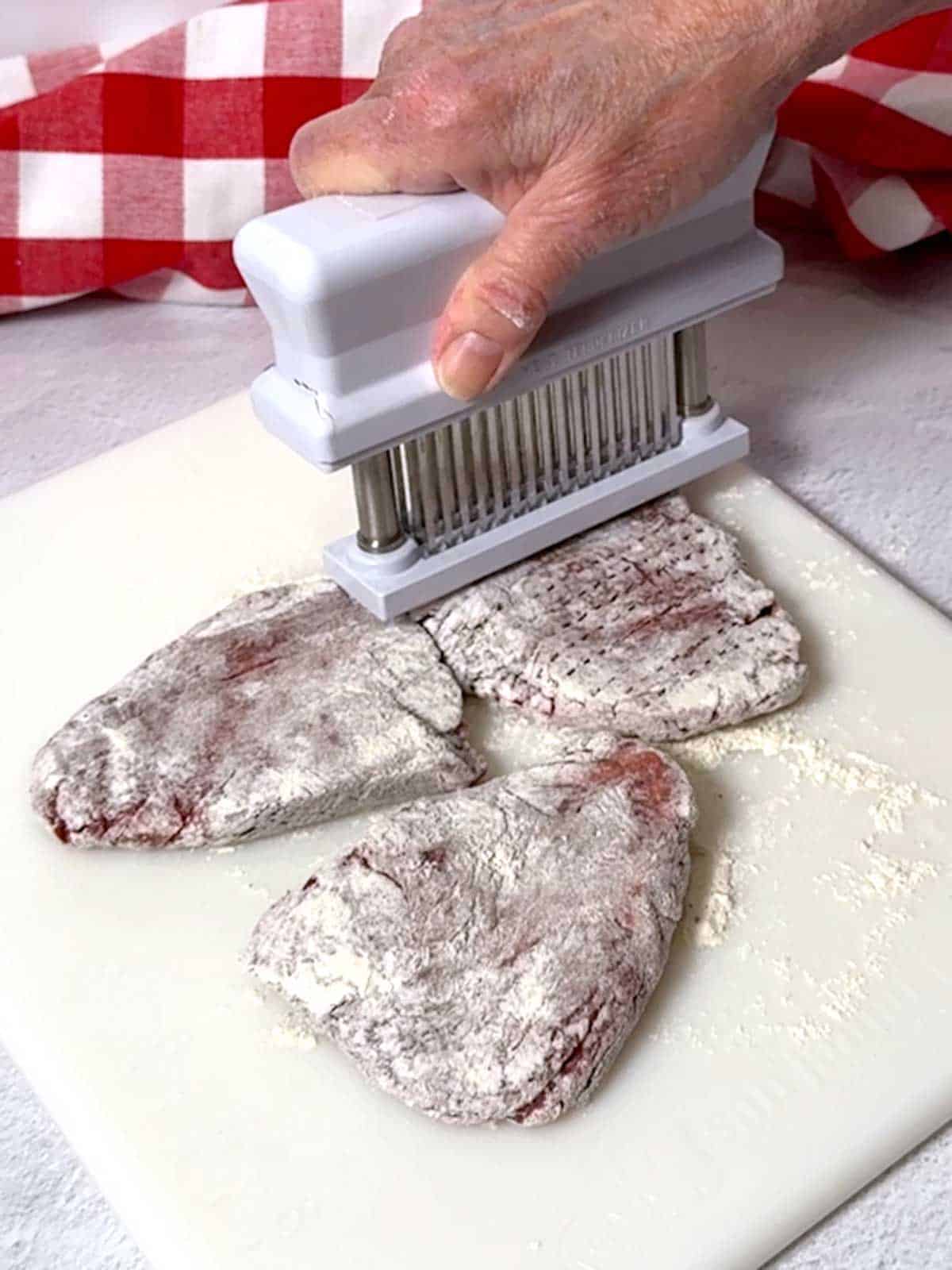 Tenderizing the beef.
