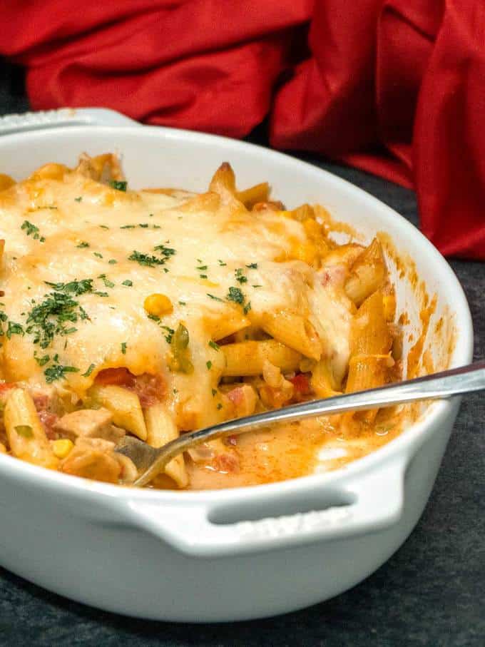 Southwestern Chicken Pasta in casserole dish with spoon