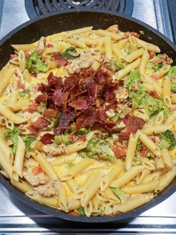 Adding bacon to creamy chicken broccoli pasta