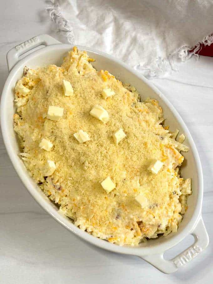 Hash Brown casserole with Panko bread crumbs and dotted with butter