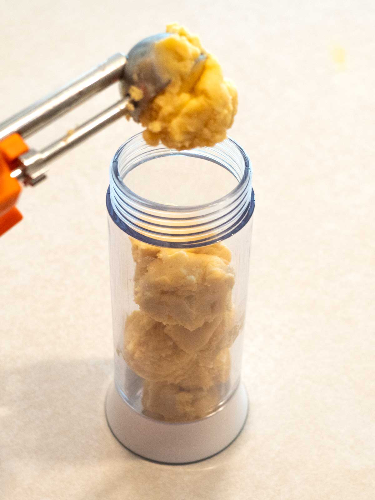 Adding dough to the cookie press