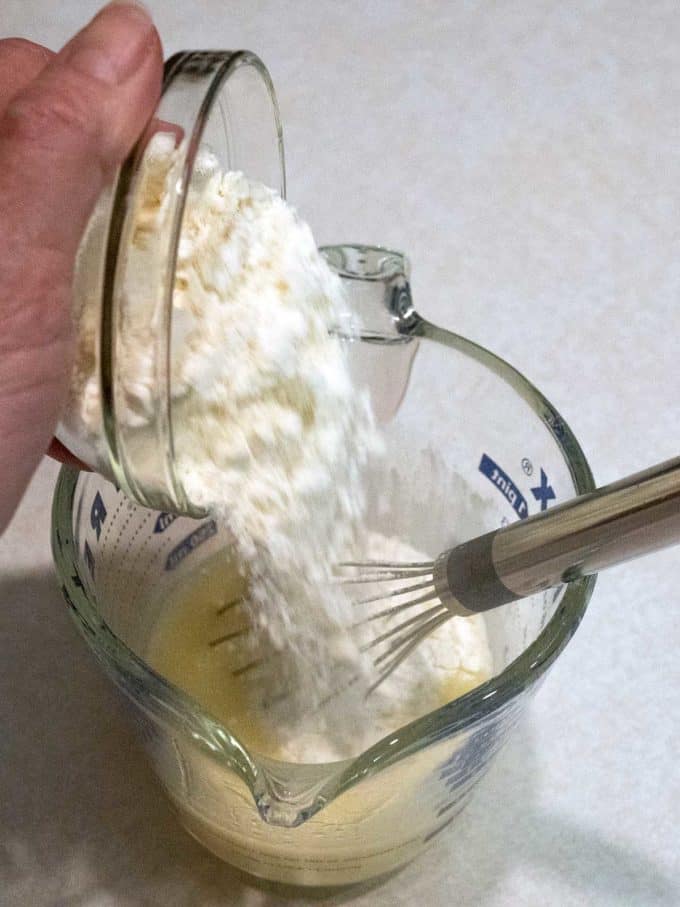 Adding flour to crepe batter