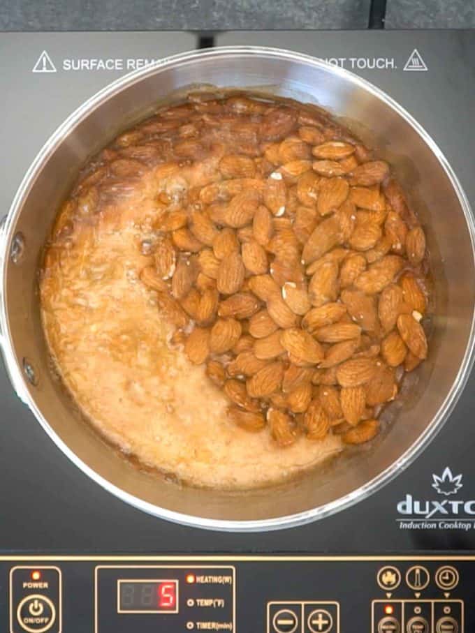 Adding almonds to sugar mixture