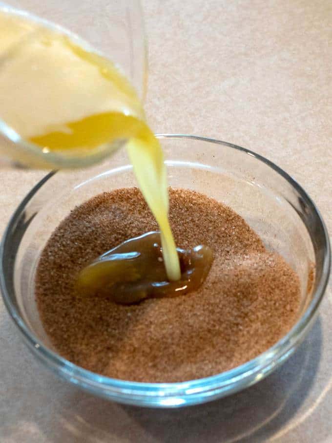 Adding melted butter to sugar/cinnamon mixture
