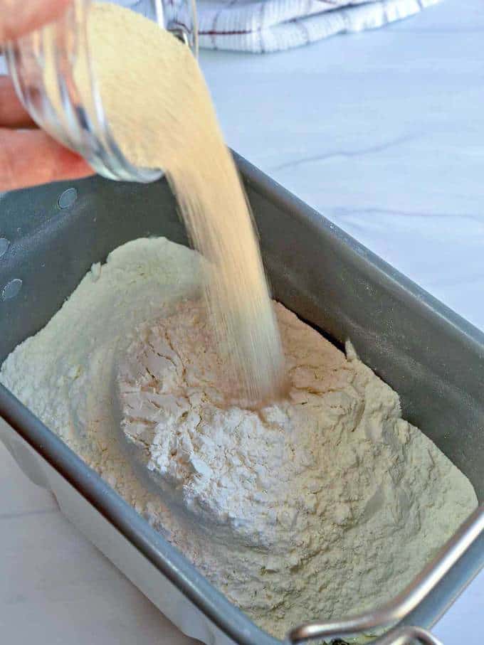 Adding yeast to bread machine pan