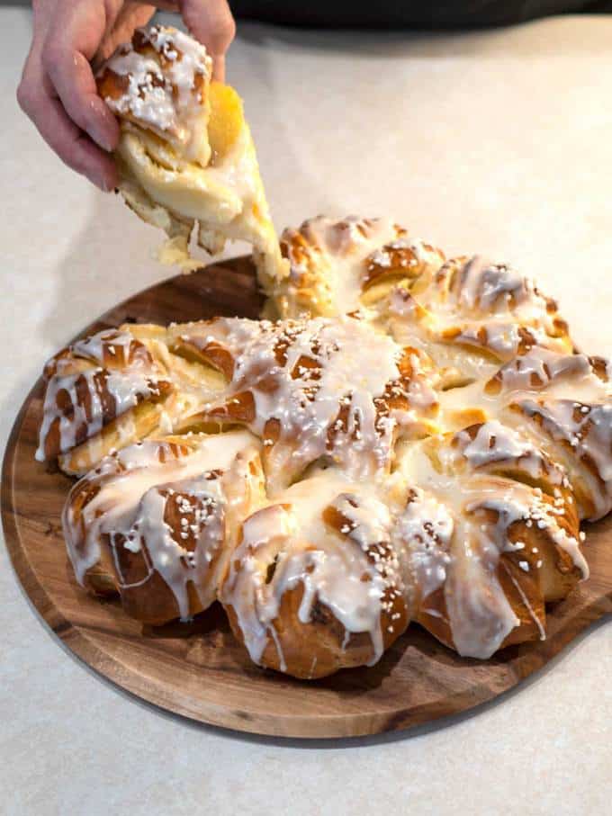 Pulling the first piece of the bread for a taste