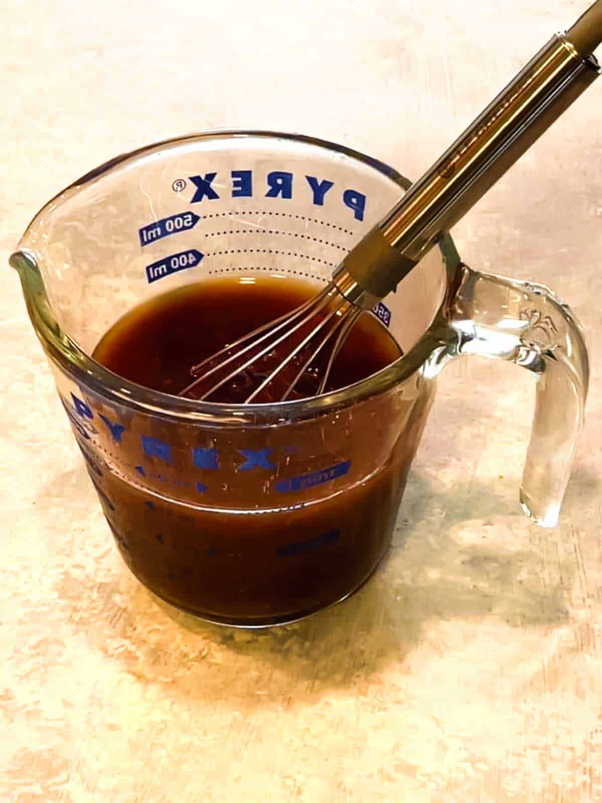Whisking the broth
