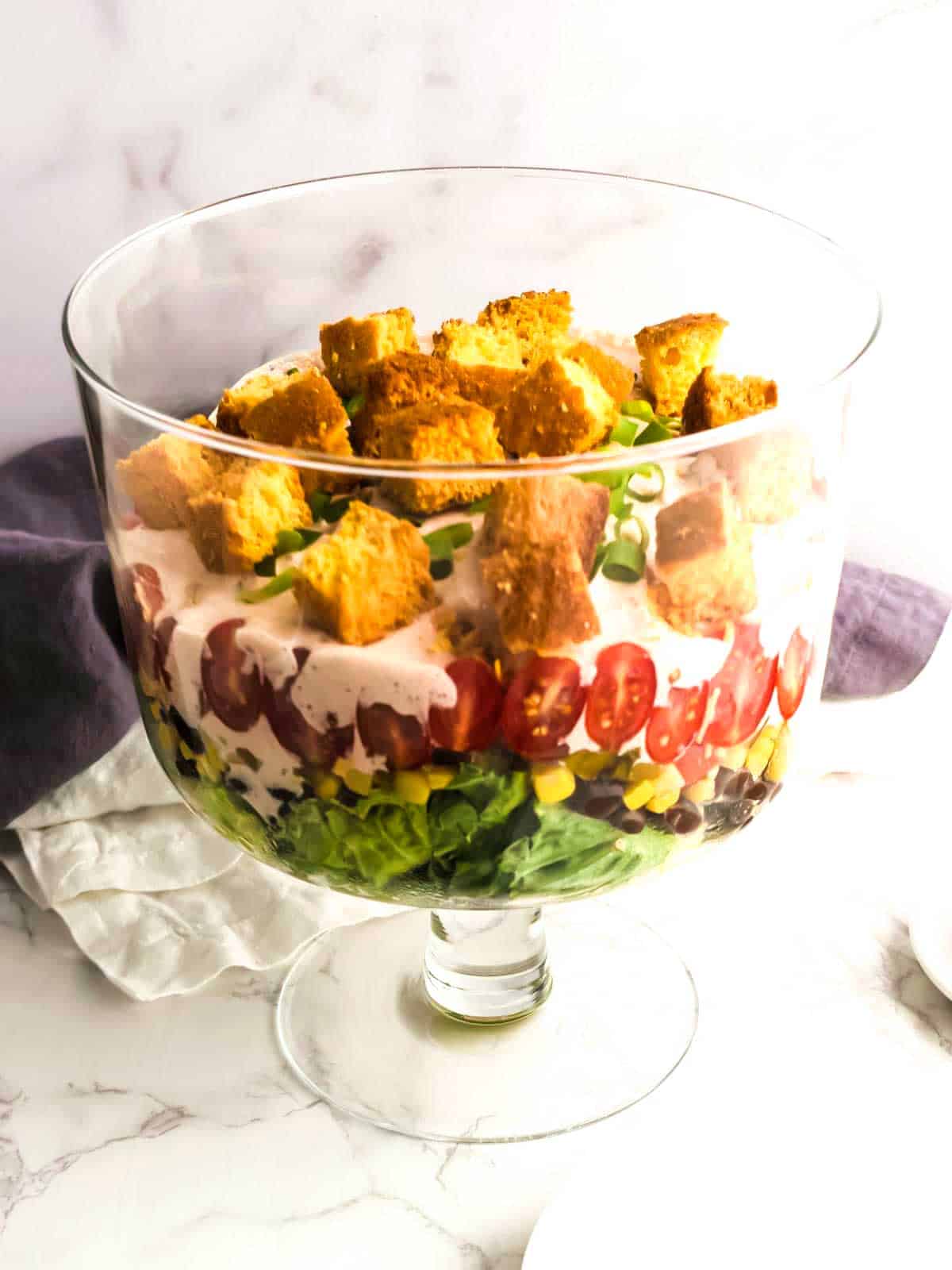 Salad topped with cornbread croutons