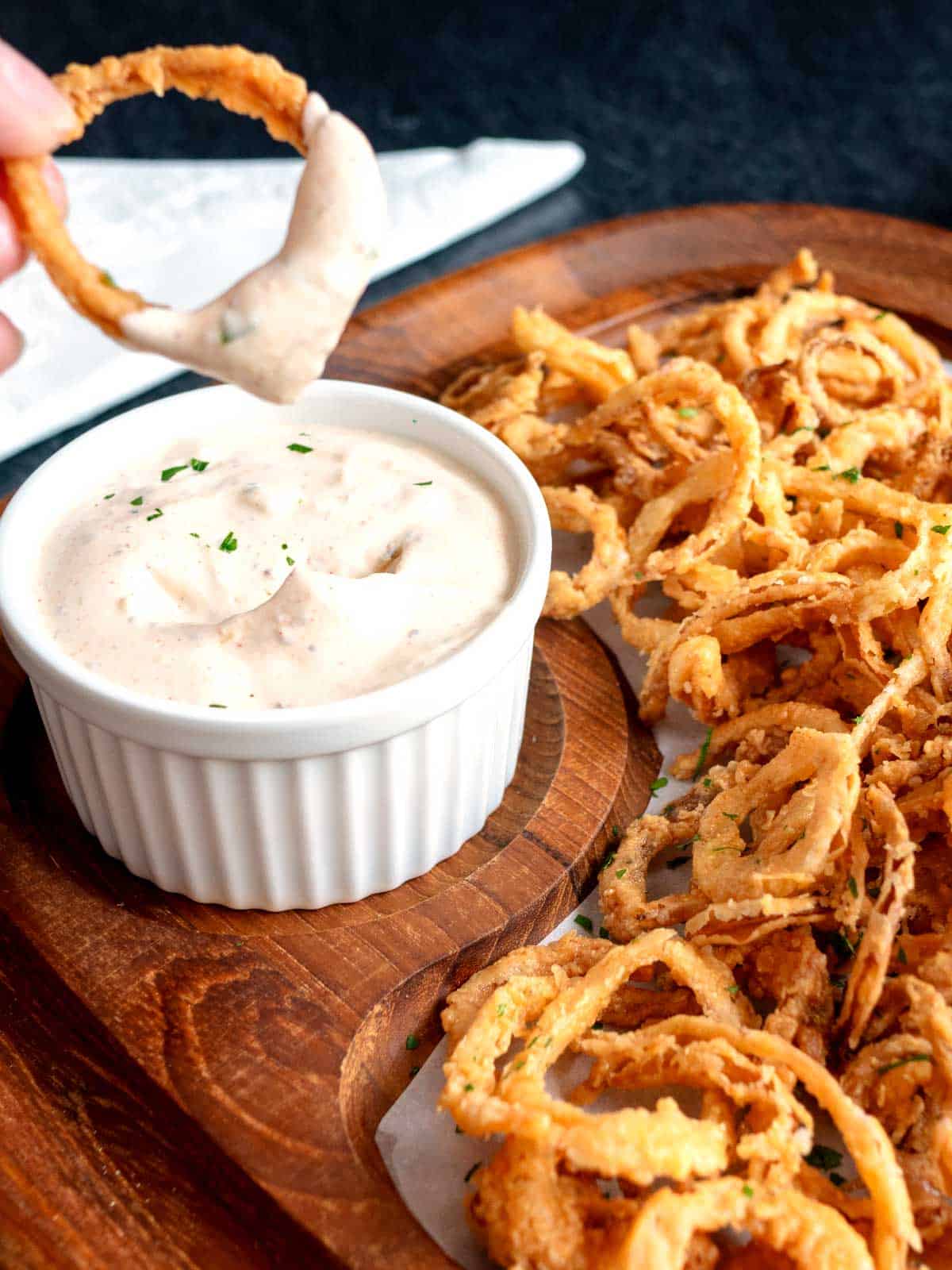 Cajun onion strings with spicy dipping sauce.